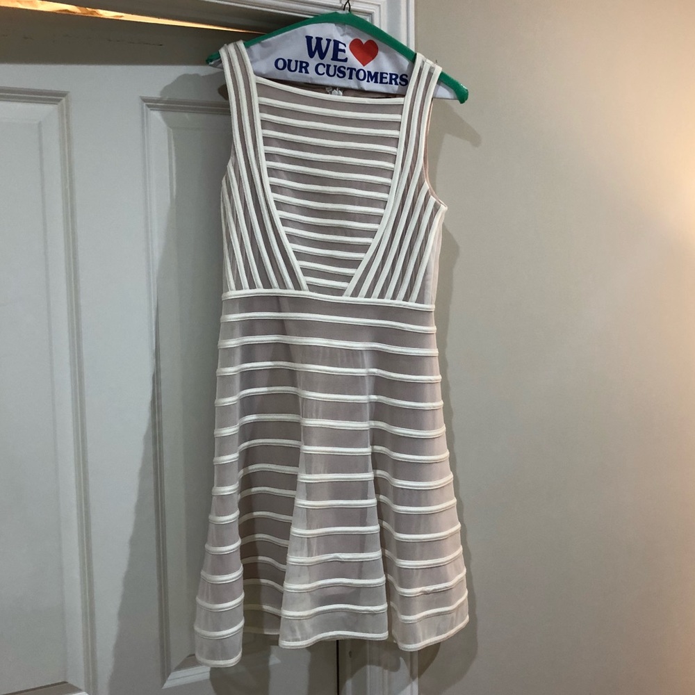 Super flattering, nude lined dress!